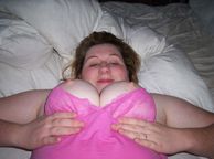 Fat Amateur Lady Laying Down Holding Tits - chubby next door with busty tatas